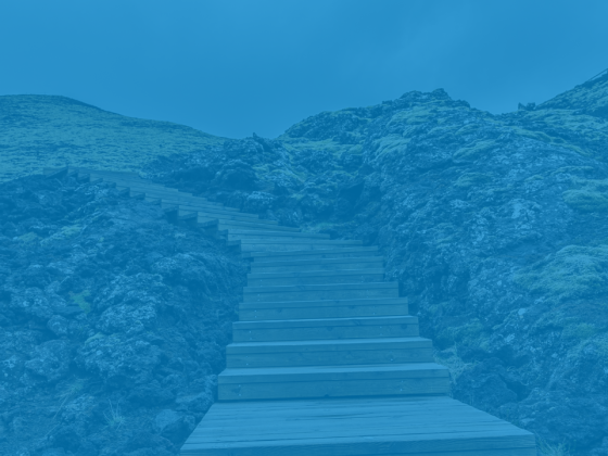 A blue background with steps leading upward, symbolizing progress.