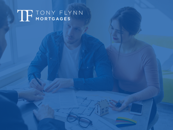 A couple with a blue overlay signing mortgage documents, symbolizing the process of securing a mortgage.
