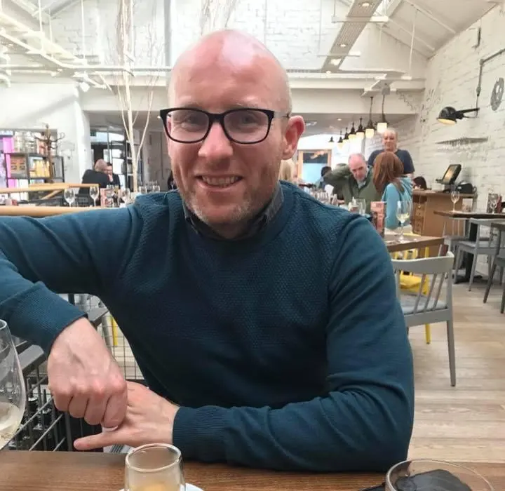 Tony Flynn, mortgage adviser in Carluke, smiling in a relaxed setting